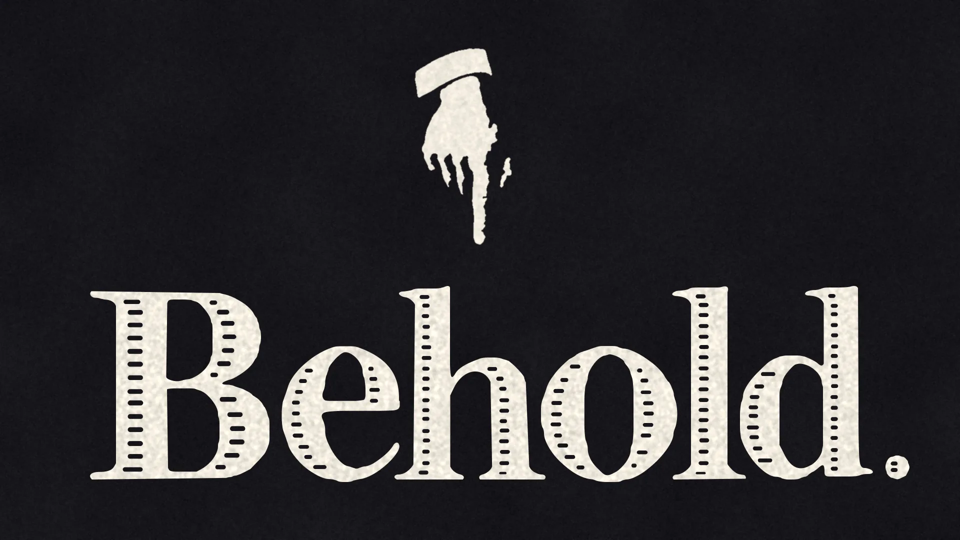 An engraved hand with a white shirt cuff points down at the word Behold. set large in paper-white inline serif letters on black.