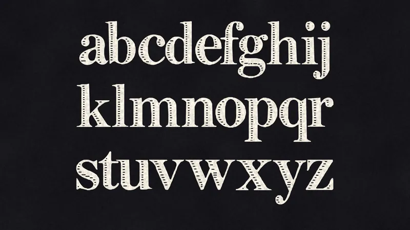 Lowercase a to z of INK FILIGREE in three rows of paper-white letters on black.