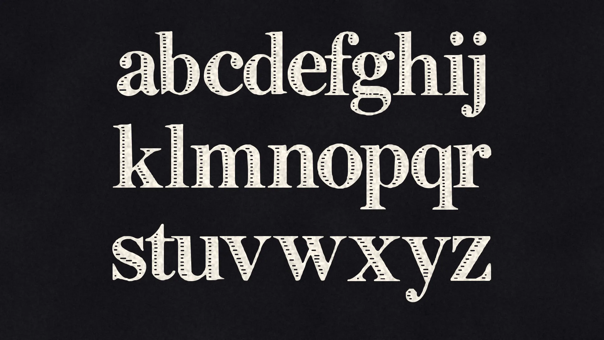 Lowercase a to z of INK FILIGREE in three rows of paper-white letters on black.