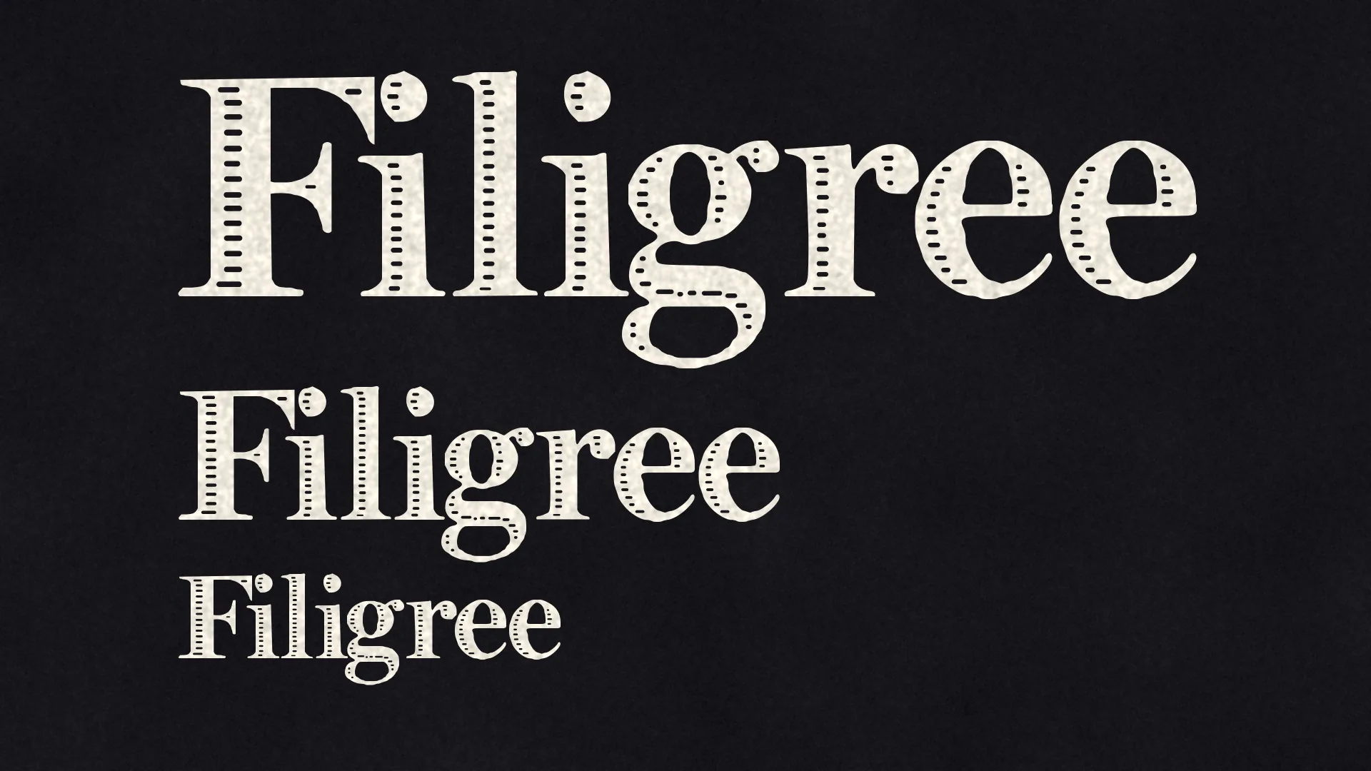 The word Filigree at three sizes in paper-white letters on black, its slits growing finer as the letters get smaller.