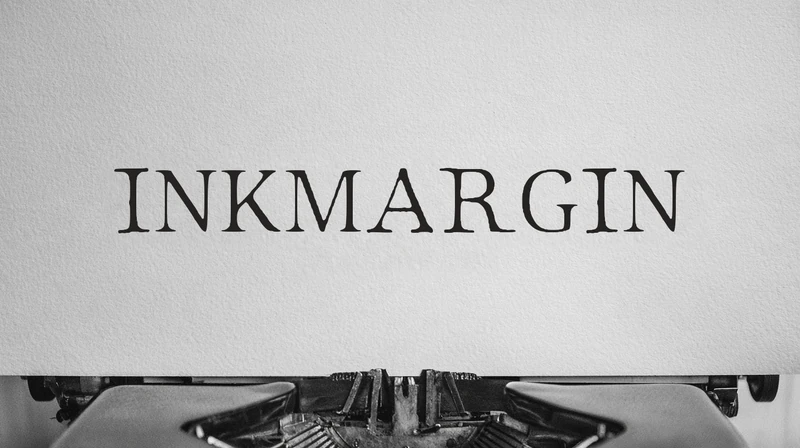 INKMARGIN on paper in a typewriter.