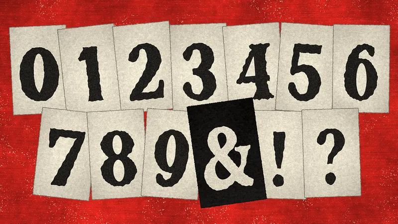 Numerals 0 to 9 and the ampersand, exclamation and question marks on paper slips on a red field, the ampersand on a black slip.